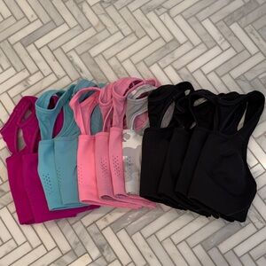 Avia Sports Bras in Magenta, Black, Turquoise, Pink, and Gray Camo (12 in total)